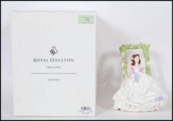A collection of ceramic figurines comprising a Royal Doulton HN5096 Pretty Ladies Blossomtime /