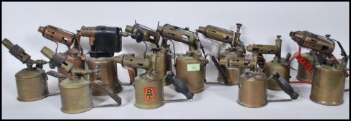 A collection of vintage 20th Century brass and copper blow torches to include many makes such as