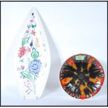 Two 20th Century Poole studio pottery cabinet plates, the spear plate decorated with flowers,