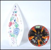 Two 20th Century Poole studio pottery cabinet plates, the spear plate decorated with flowers,