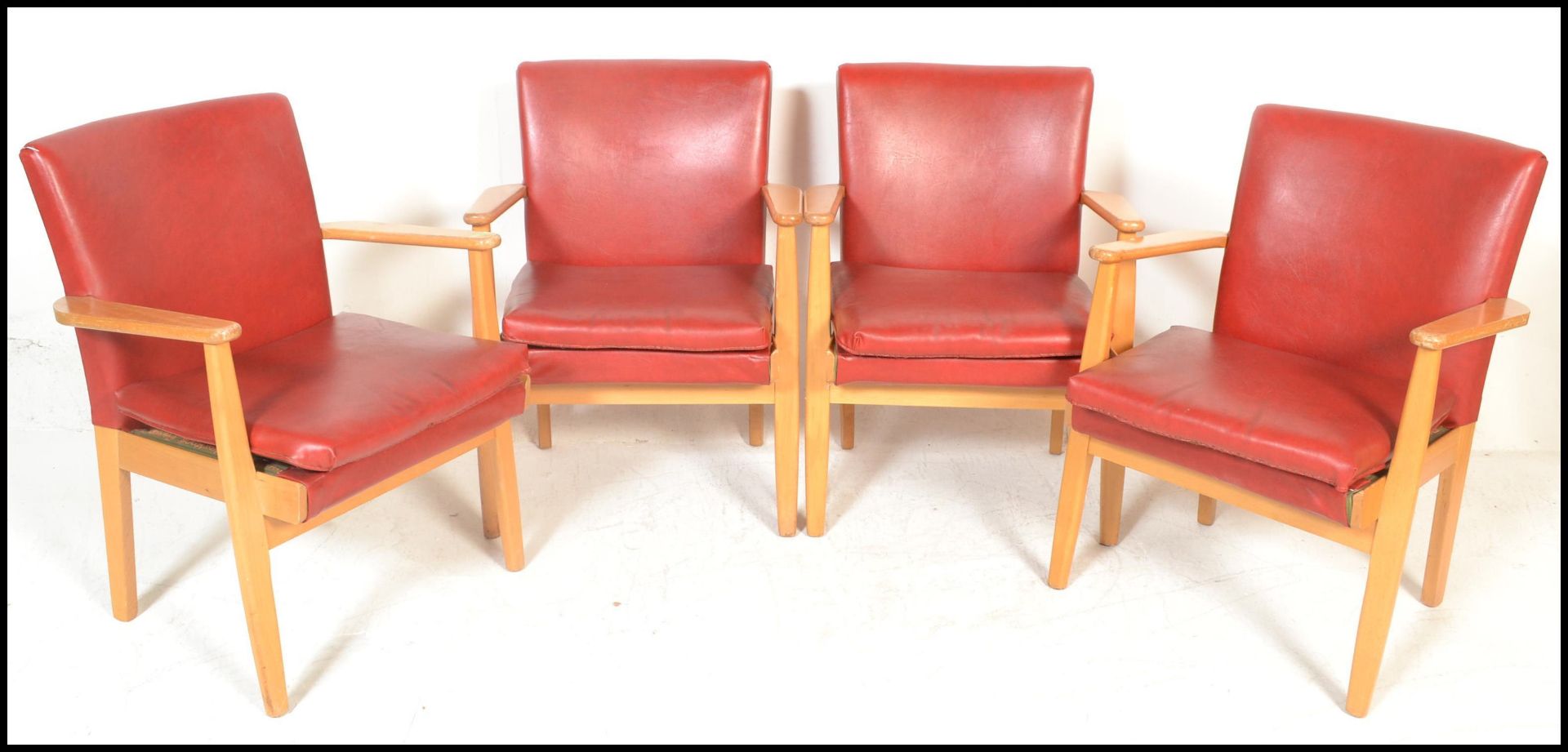 A set of four vintage retro Parker Knoll model 733 open framed armchairs, sweeping arms, seat pads
