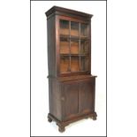 A 19th century Victorian library bookcase cabinet. Raised on shaped bracket feet with locker door
