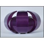A vintage retro layered shaped ceiling light fixture, constructed from a purple moulded fabric.