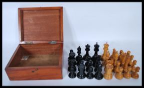 A 20th Century believed Staunton Chessmen boxwood and ebony Chess set by J. Jaques and Son Ltd of