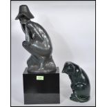 Two 20th Century cast Austin sculptures to include a stylised cat along with a sculpture of