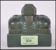 A 20th Century green resin seal stamp of large proportions having a Chinese dragon design to the