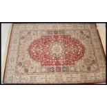 A large Persian floor carpet Keshan rug having a r