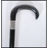 A early 20th Century 1920's silver collared promenade walking stick cane having horn crook handle