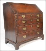 An 18th / 19th Century Georgian country oak  fall front bureau having a fully appointed interior