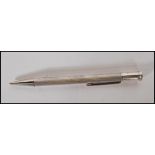 A mid 20th Century William Manton silver hallmarked propelling pencil having engine turned