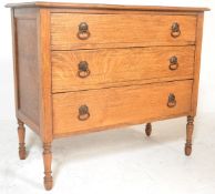 A 1920's oak bedroom chest of drawers. Raised on turned legs with a configuration of short and