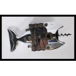 A retro chrome corkscrew / bottle opener in the form of a fish. Made in England by Lazy Fish.