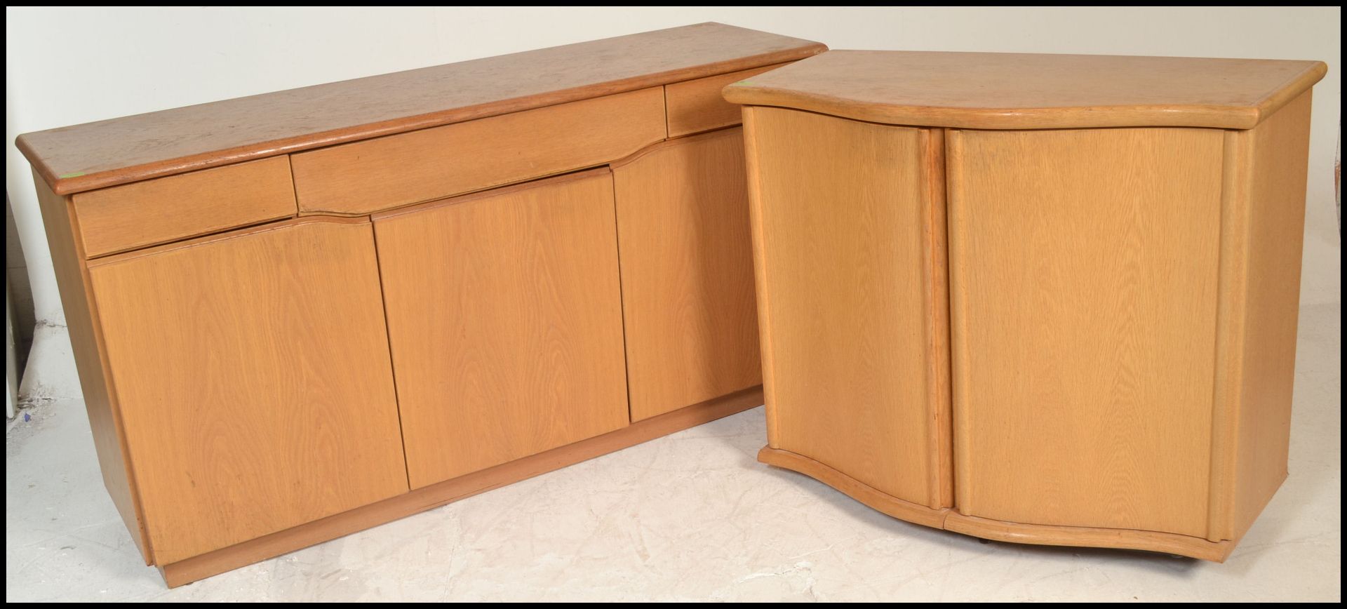 A Skovby 20th century light oak sideboard having a wide body with a series of blind fronted