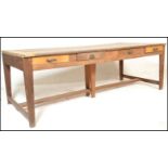 A large 19th century French pine, oak and elm wood  country refectory dining table. The 5 planked