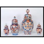 Two 19th / 18th Century Japanese Imari lidded jars of ovoid form each painted in typical style