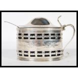 A George III large silver hallmarked and blue glass lined condiment lidded dish with handle by