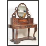 A Victorian mahogany duchess dressing table raised on turned supports with serpentine shaped