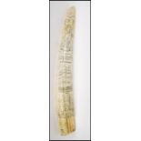 A 20th Century faux scrimshaw tusk engraved Liberty for the ship James Allen being engraved with the