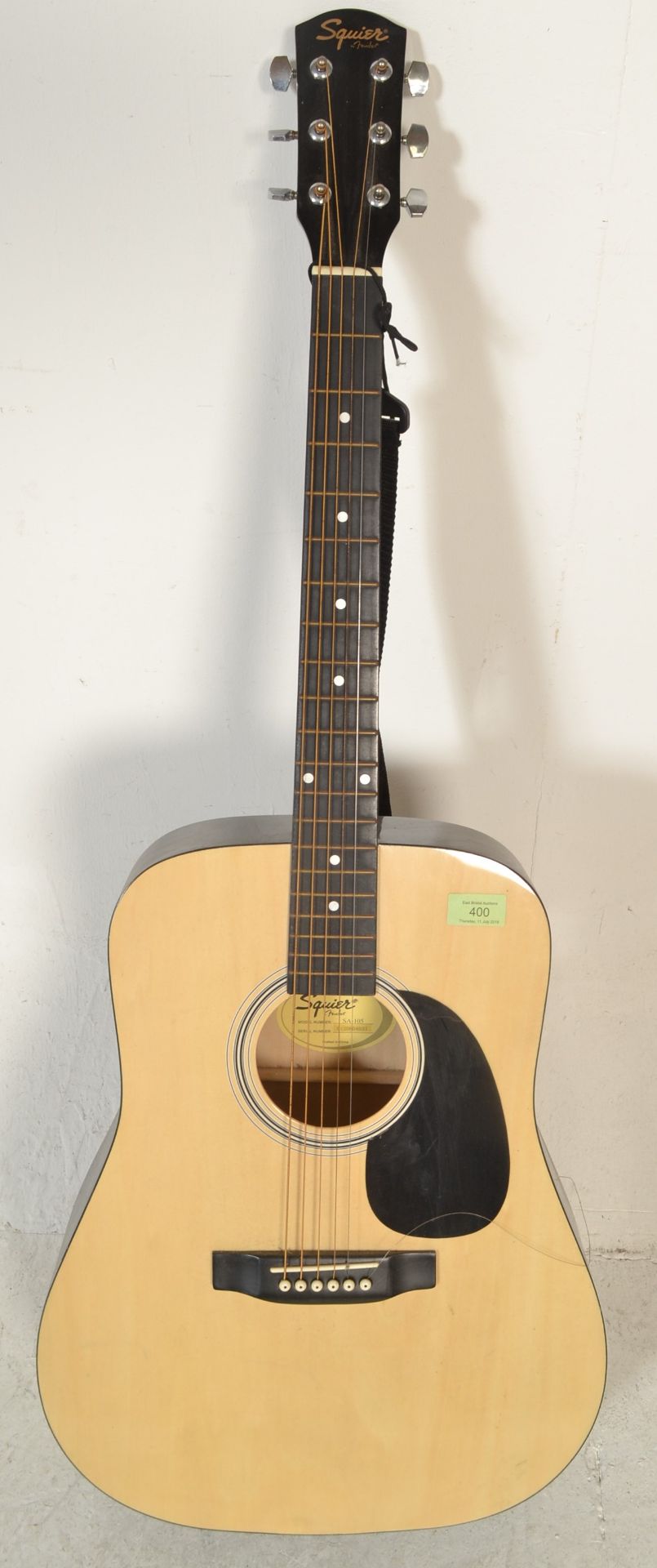 A 20th Century acoustic Squire by Fender six string guitar having a shaped hollow body with mother