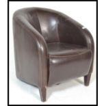 A contemporary leather tub chair / armchair. Raise