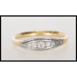 A stamped 18ct gold ring set with a row of round cut graduating diamonds to the head. Weight 2.5g.