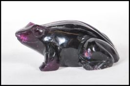 A 20th Century carved amethyst figurine in the form of a tropical frog.