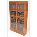 A 20th Century mahogany three sectional lawyers bookcase in the manner of Globe Wernicke. The
