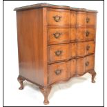 A good Queen Anne revival walnut serpentine fronted bachelors chest of drawers. Raised on stub