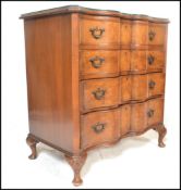 A good Queen Anne revival walnut serpentine fronted bachelors chest of drawers. Raised on stub