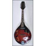An electric eight string mandolin by Sonata having a shaped dark red body and white borders, with
