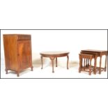 An early 20th century mahogany pedestal cabinet raised on cabriole legs with single drawer over