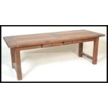 A 20th Century French oak extendable  refectory di