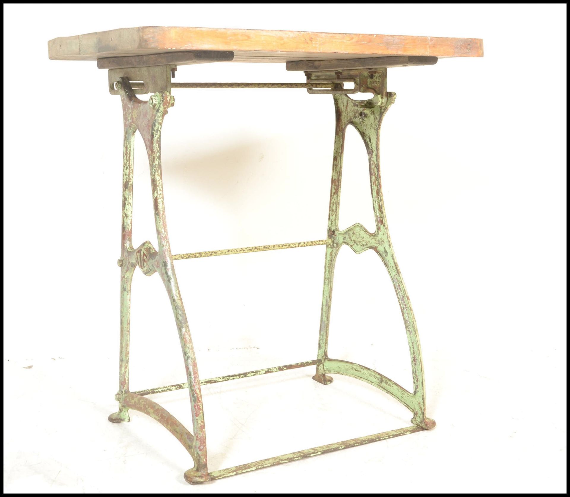 A late 19th Century upcycled cast metal work base, converted to a garden table,the base being