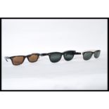 A group of three designer sunglasses by Ray Ban to