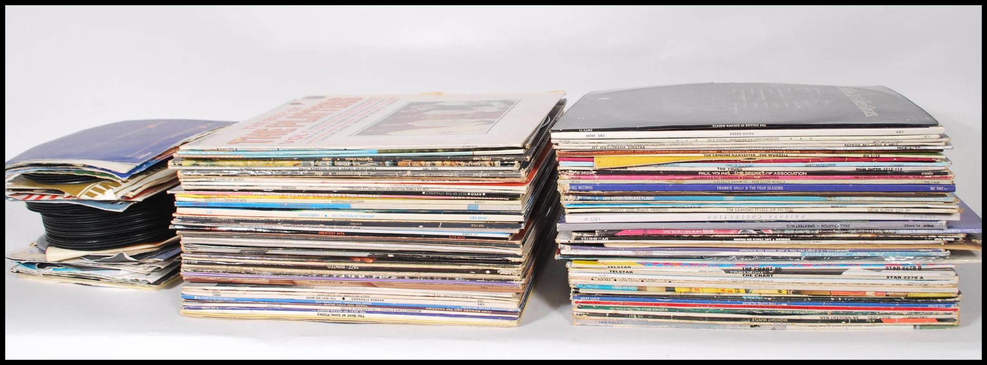 A collection of vinyl long play LP record albums featuring several artists and genres to include