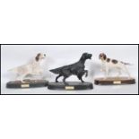 A collection of late 20th century modern Beswick porcelain figurines of dogs ( 3 total ) to