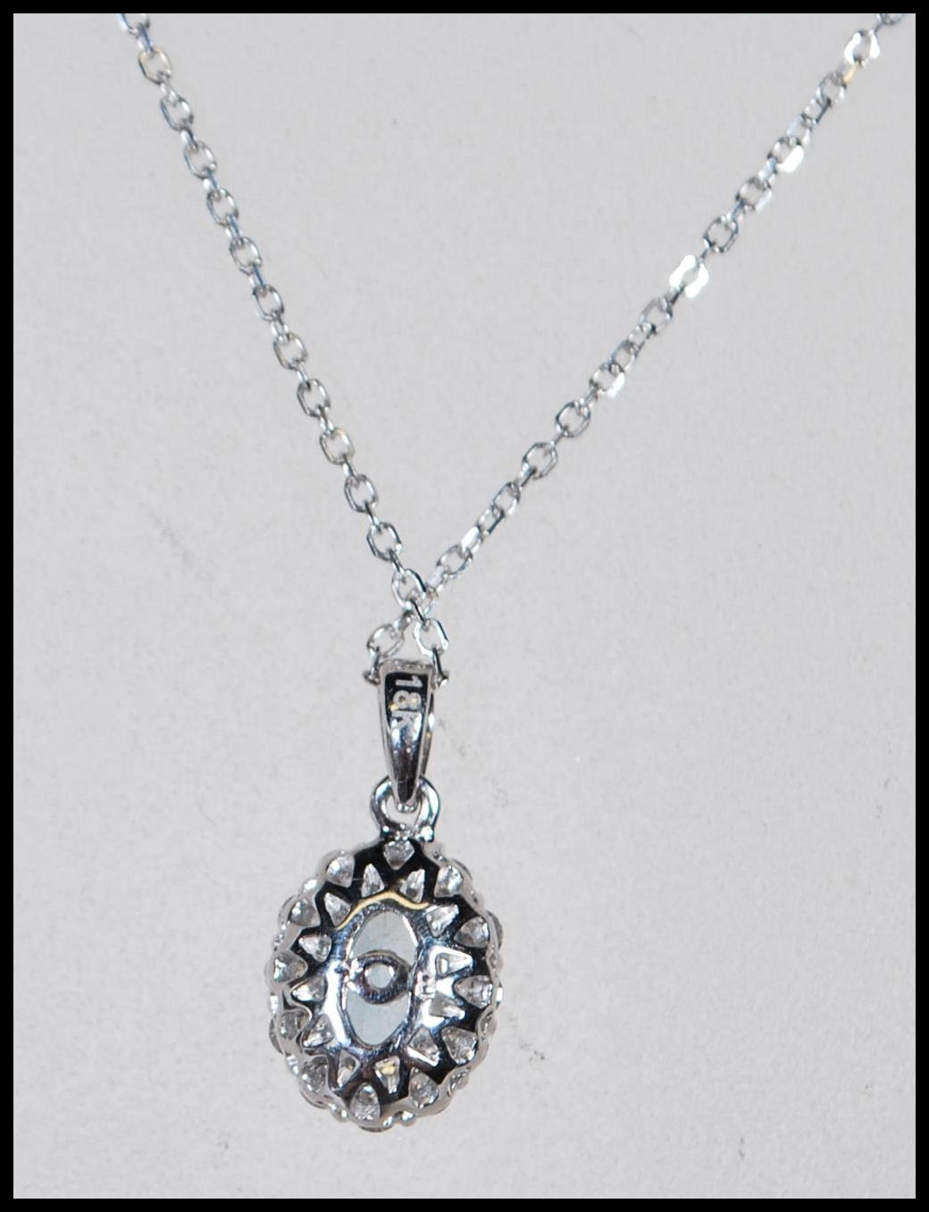 An 18ct white gold, aquamarine and diamond set necklace pendant set to a gold back chai. The central - Image 4 of 5