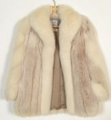 A vintage 20th Century ladies white fox fur short jacket, silk lining with makers label for F. K.