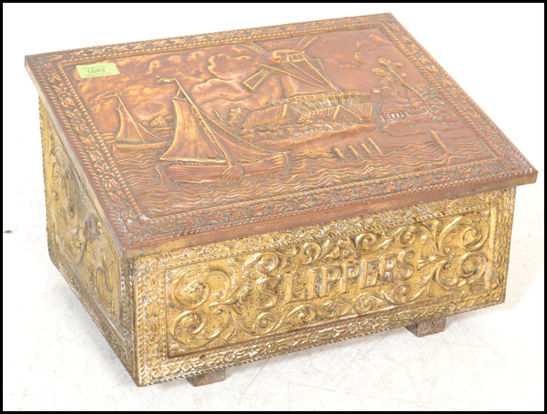 An 20th Century slippers box of wooden construction with copper panelling to the exterior having