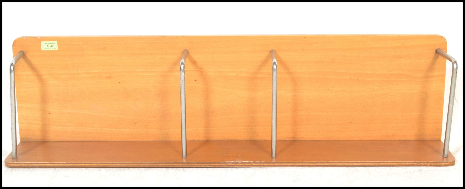 A mid 20th Century retro oak desk tidy / organiser having chrome spacers, stamped to verso for