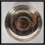 An unusual London hallmarked silver peanut dish inset with a central African coin with notation '