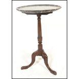 A 19th century mahogany wine table of good proportions. The tripod base with scrolled legs and
