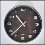A retro 20th Century industrial / factory / school wall clock by Metamec, brown body with white face