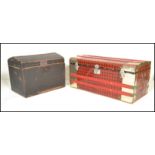 Two vintage 20th Century trunks, one being cover in tin having red and black tartan decoration