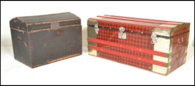 Two vintage 20th Century trunks, one being cover in tin having red and black tartan decoration