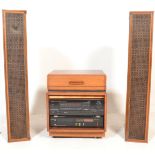 A vintage 20th Century teak wood cased music cabin