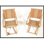 A pair of vintage early 20th Century folding camping / picnic chairs, wooden frame with original