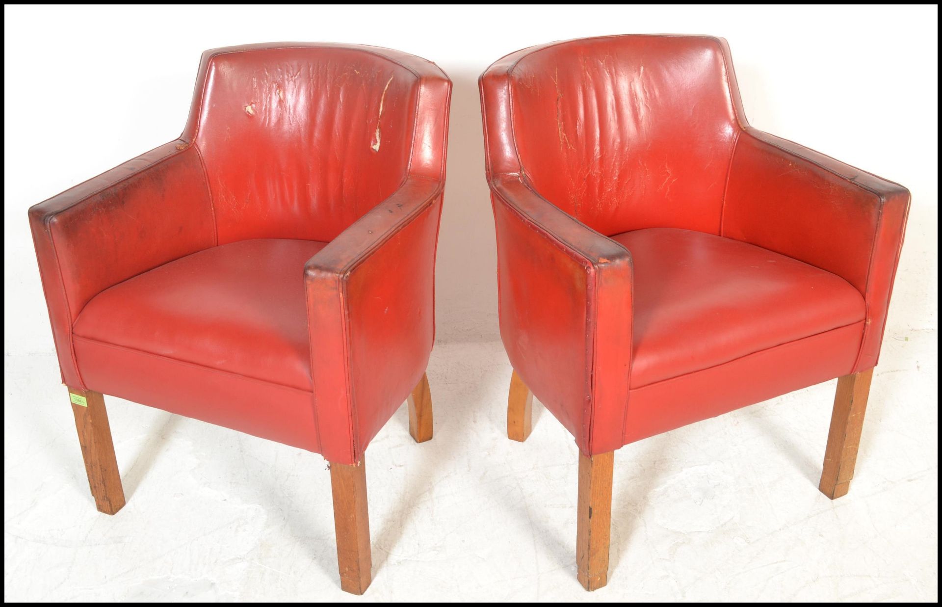 A pair of mid 20th Century tub / club / armchairs, raised on beech square supports, upholstered in - Bild 2 aus 6