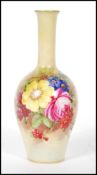 A mid 20th Century J Freeman for Royal Worcester stem vase, being hand painted with floral sprays