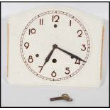 An early 20th Century Art Deco ceramic wall clock